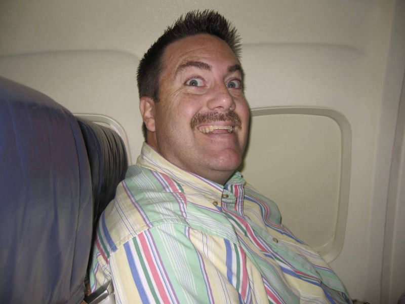 David Brodosi flying on an airplane